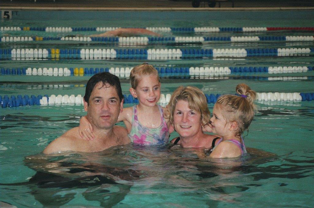Picture of UG, J, SJ and LM in a pool in Raleigh