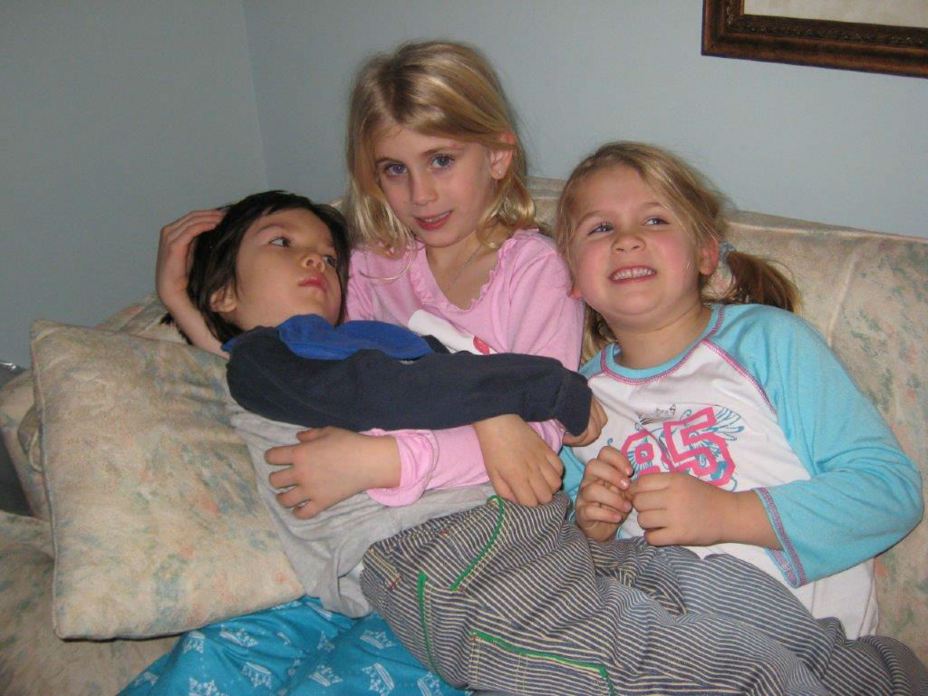 Picture of SJ and LM holding G in Cary