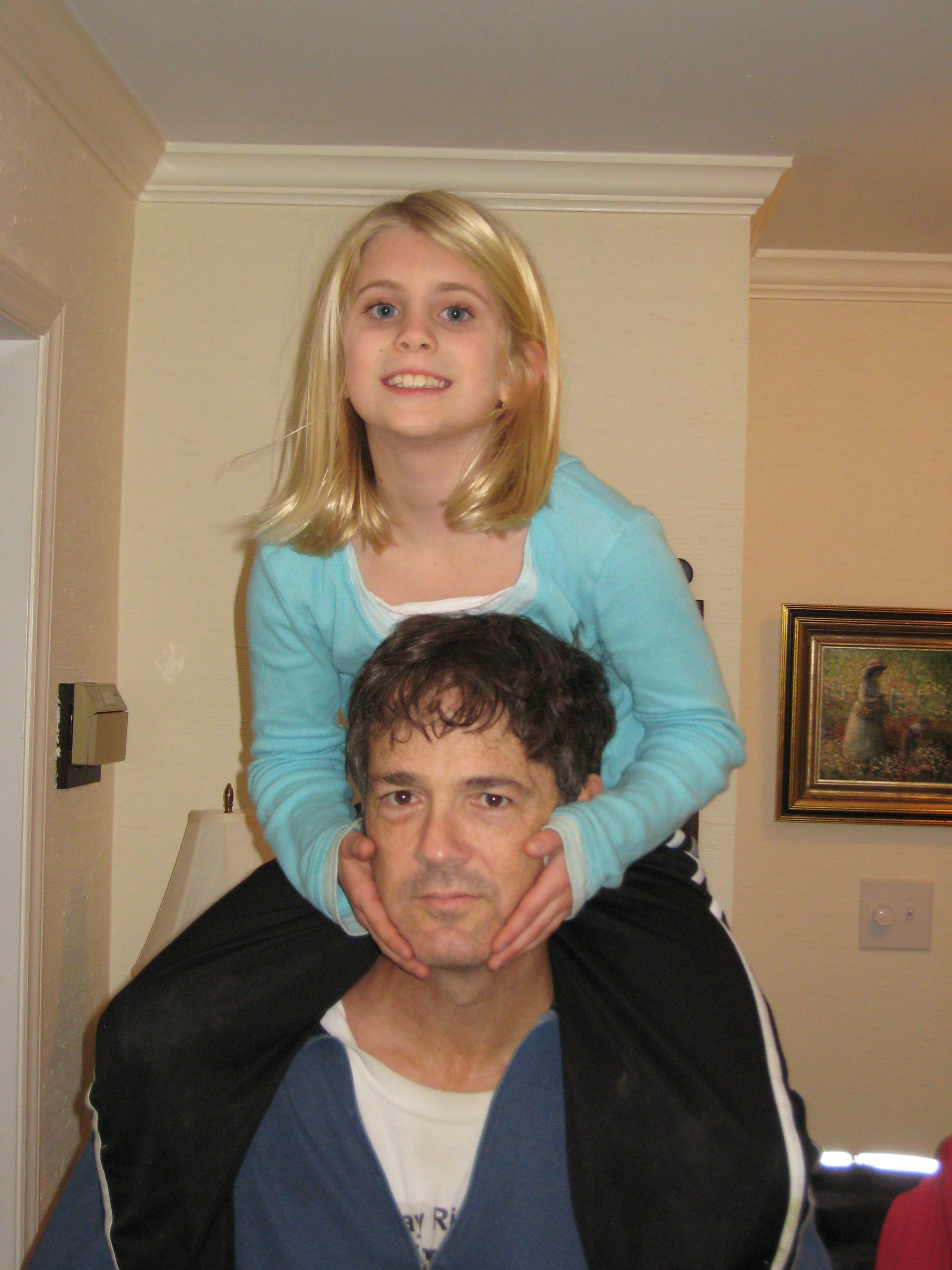 Picture of UG holding SJ on his shoulders in Raleigh